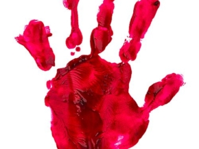 Bloody print of a hand and fingers on white wall